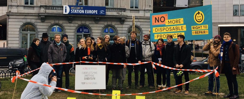 Right to Repair activists standing outside the European Parliament