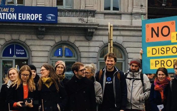 Right to Repair activists standing outside the European Parliament